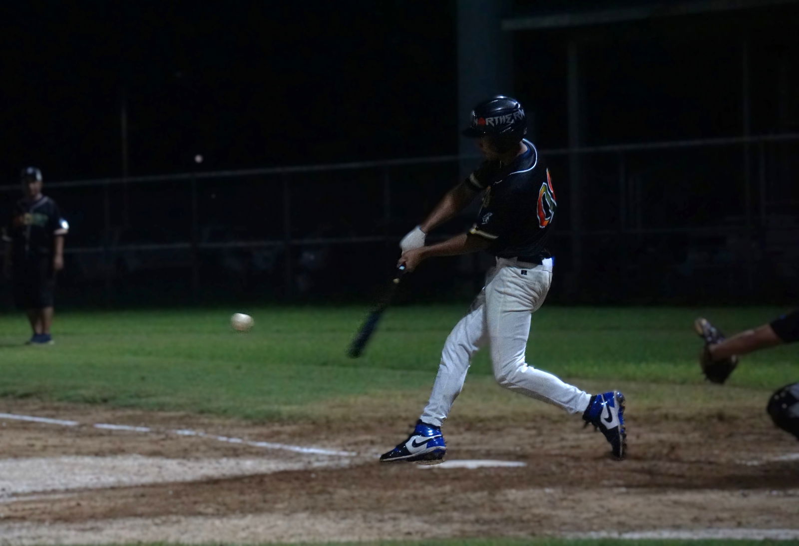 Joseph Lifoifoi of the Falcons hits a single during a 2025 Saipan Baseball League game against Blue Shark on Tuesday night.Photo by James F. Sablan Jr.