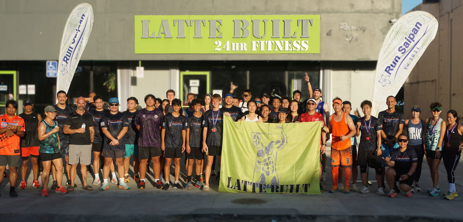 Participants of the July 4th Independence Day 2-Mile Race 2025 pose for a photo at the Latte Built gym on Beach Road in Chalan Kanoa, Friday morning.Photo by James F. Sablan Jr.