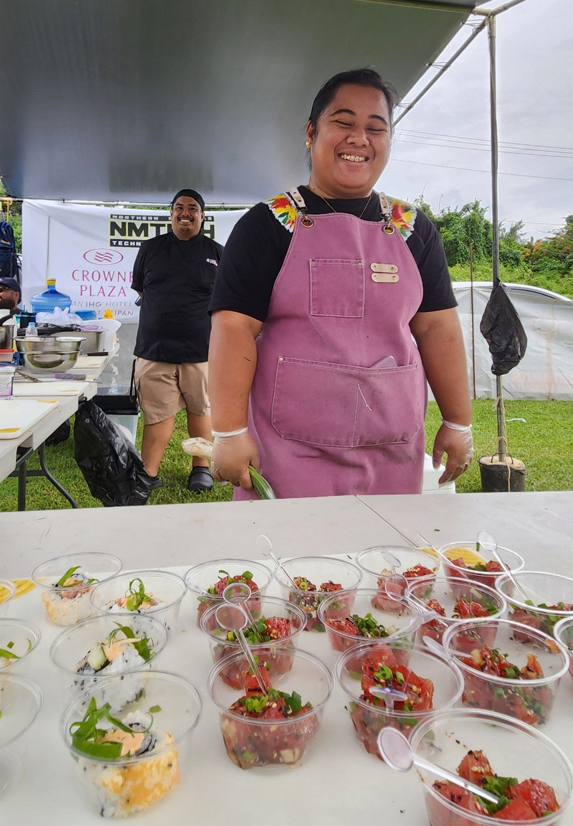 Northern Marianas Technical Institute showcases their culinary skills with free sashimi samples at the Saipan International Fishing Tournament festival on July 13, 2025, at Smiling Cove Marina.