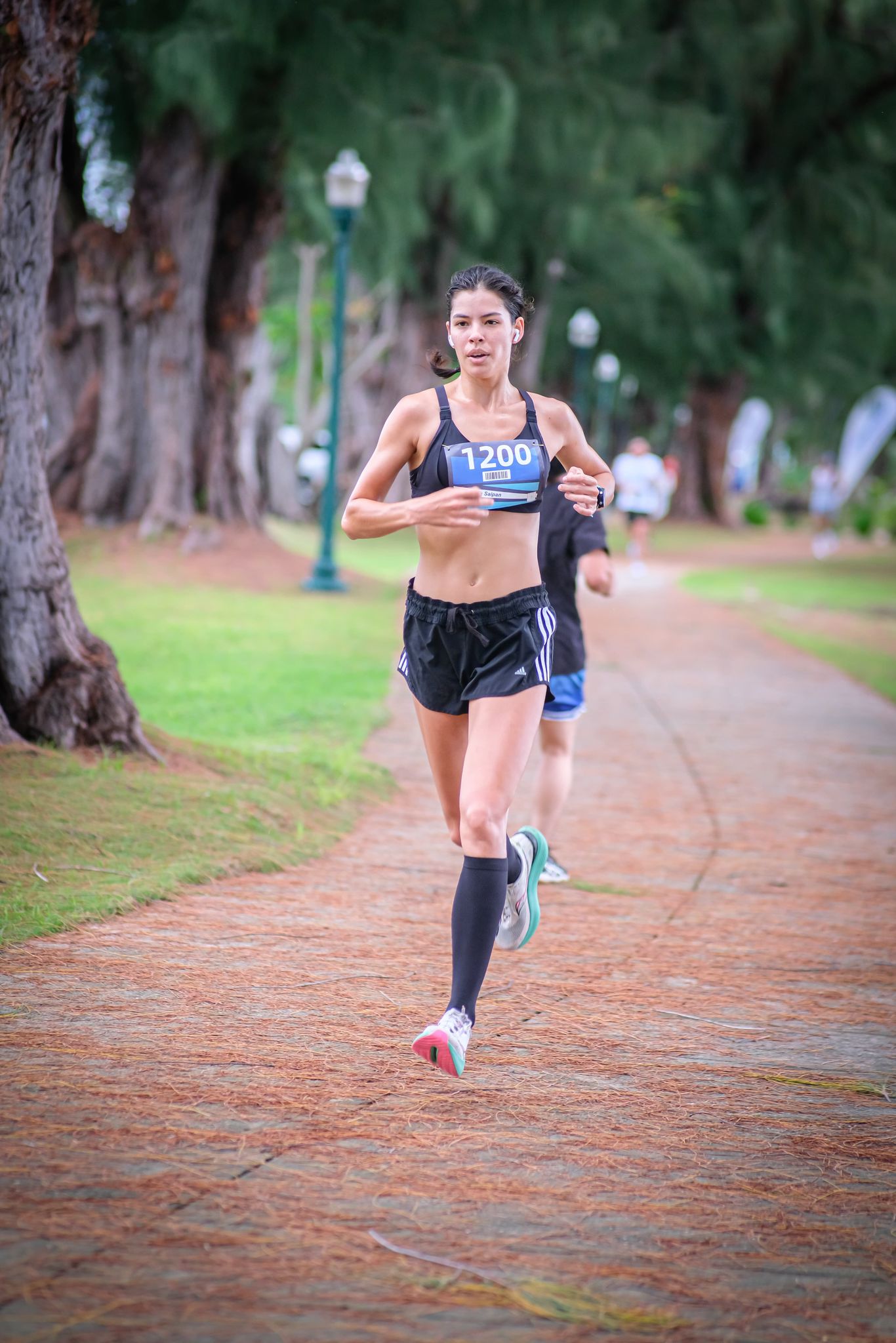 Tammy Ackerman makes her way toward the turnaround point as she leads the women's division of the inaugural Roll Out 5K, hosted by the Commonwealth Office of Transit Authority and Run Saipan on Wednesday afternoon at Garapan Fishing Base.Photo by Jonathan Sugatan