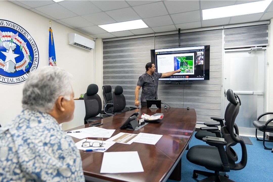 Gov. Arnold Palacios and Glen Hunter, special assistant to the governor, meet via video call with Brian Quigley, vice president of global network infrastructure at Google, for an update on the PCI project.