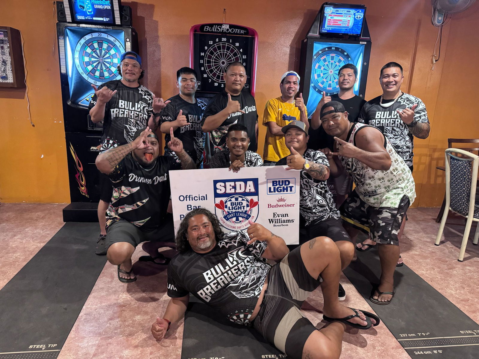 Tom Yum Bull Breakers and Tom Yum Drunken Drunken Dartz players pose for a photo after their match in the A Division of the 2025 SEDA Bud Light Dart League at the Tom Yum Restaurant on Monday evening.Contributed photo