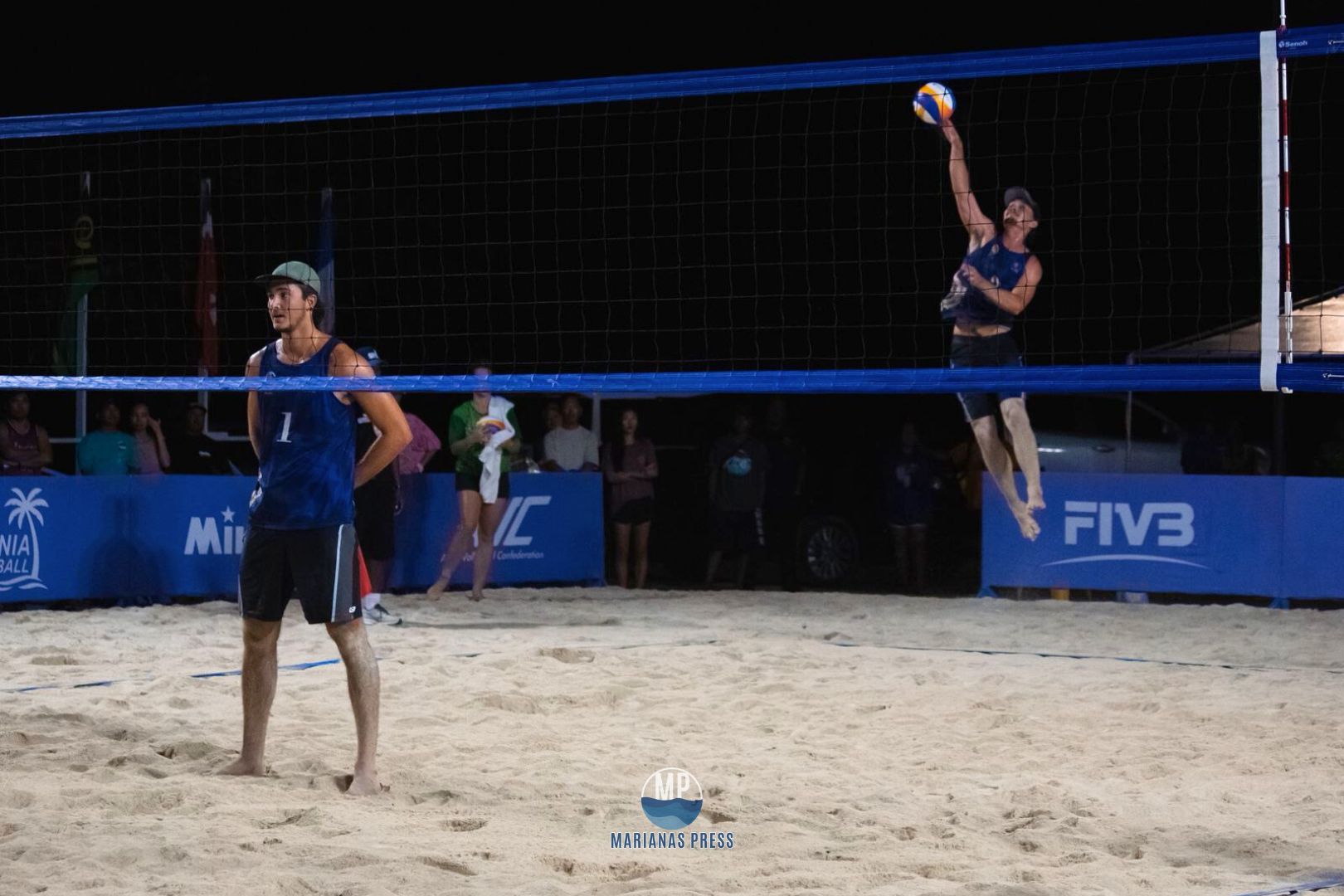 NMI's Andrew Johnson connects the overhead serve against Australia during the gold medal match in beach volleyball at the 2025 Pacific Mini Games in Koror, Palau.Marianas Press photo