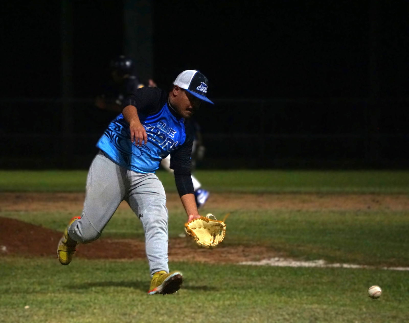 Blue Shark pitcher Orren Cruz reaches out to secure a bunt attempt by the Falcons during a 2025 Saipan Baseball League game on Tuesday night.Photo by James F. Sablan Jr.