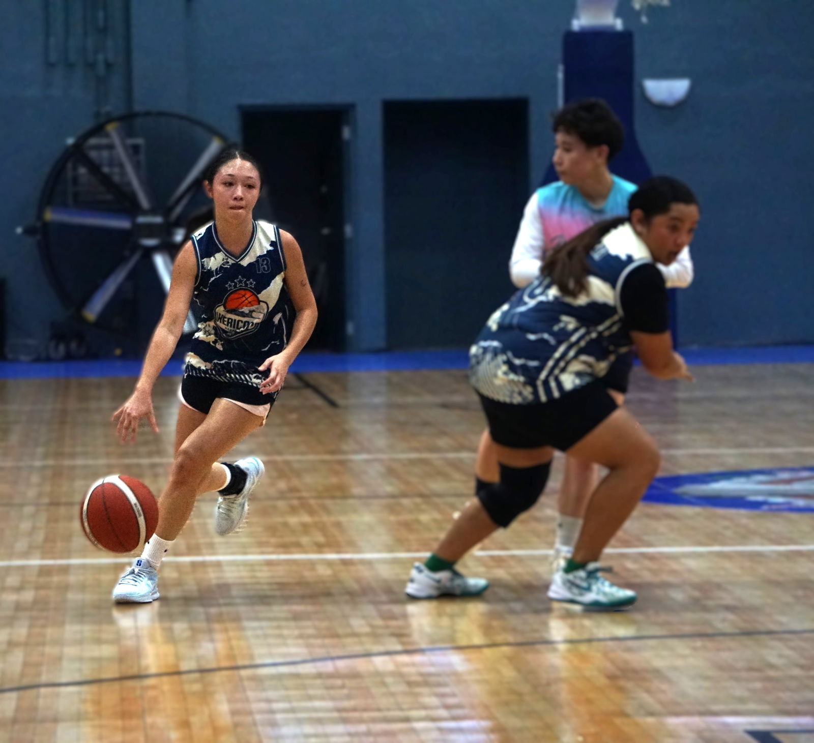 The Hericanes’ Kaia Travilla gets free from a teammate’s screen during a game against the Beach Front Ballers in the Ladies Division of the 2025 Allied Pacific Environmental Consulting Basketball League at the Ada Gym on Monday night.Photo by James F. Sablan Jr.