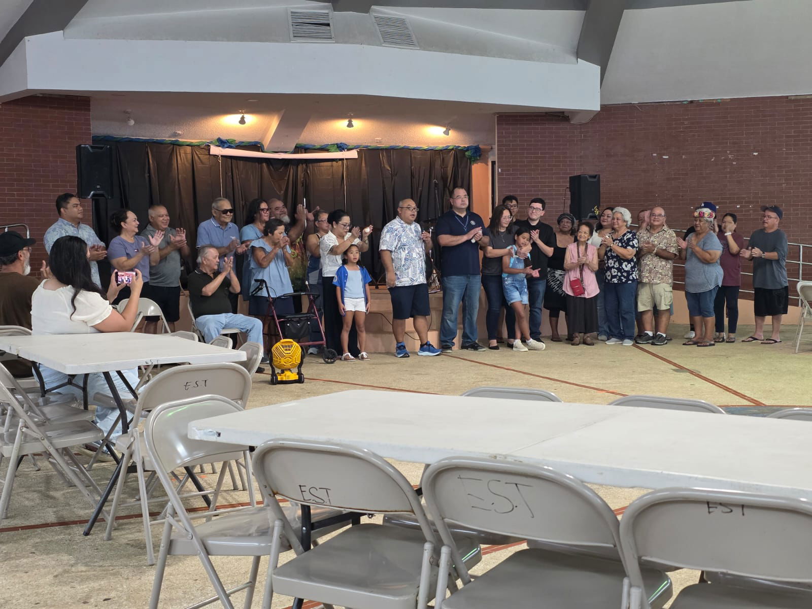 Rep. Blas Jonathan Tenorio Attao and Speaker Edmund Sablan Villagomez pose for a photo with their families at Garapan Central Park on Saturday.