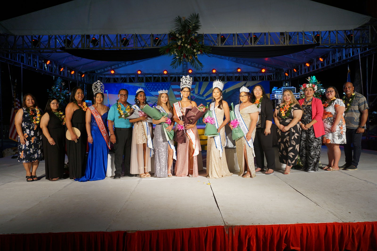2025 Liberation Queen Kaypeonie Mendiola, center, poses with her Royal Court, the Liberation Day Committee members, 2024 Liberation Queen Xeayda Manglona, Saipan Mayor RB Camacho, and Rota Mayor Aubrey Hocog.
