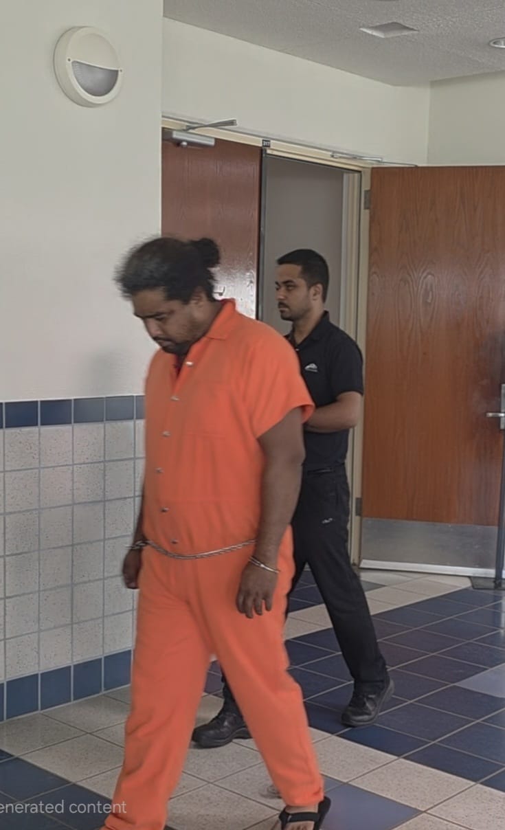 Joaquin Adriano Jr. is escorted by a Corrections officer to a bail hearing on Monday morning.Photo by Bryan Manabat