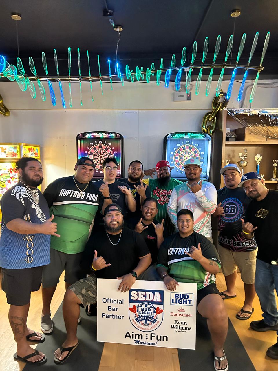 XXX Dartgineer and Bravo Hoptown Funk players pose for a photo after their match in the inter-government division of the 2025 SEDA Bud Light Dart League at the Bravo Kitchen & Bar in Garapan on Thursday night.Contributed photo