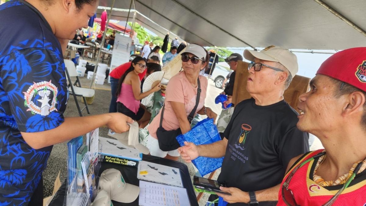 CNMI Division of Fish & Wildlife engages festivalgoers at the Saipan International Fishing Tournament festival on July 13, 2025, at Smiling Cove Marina.