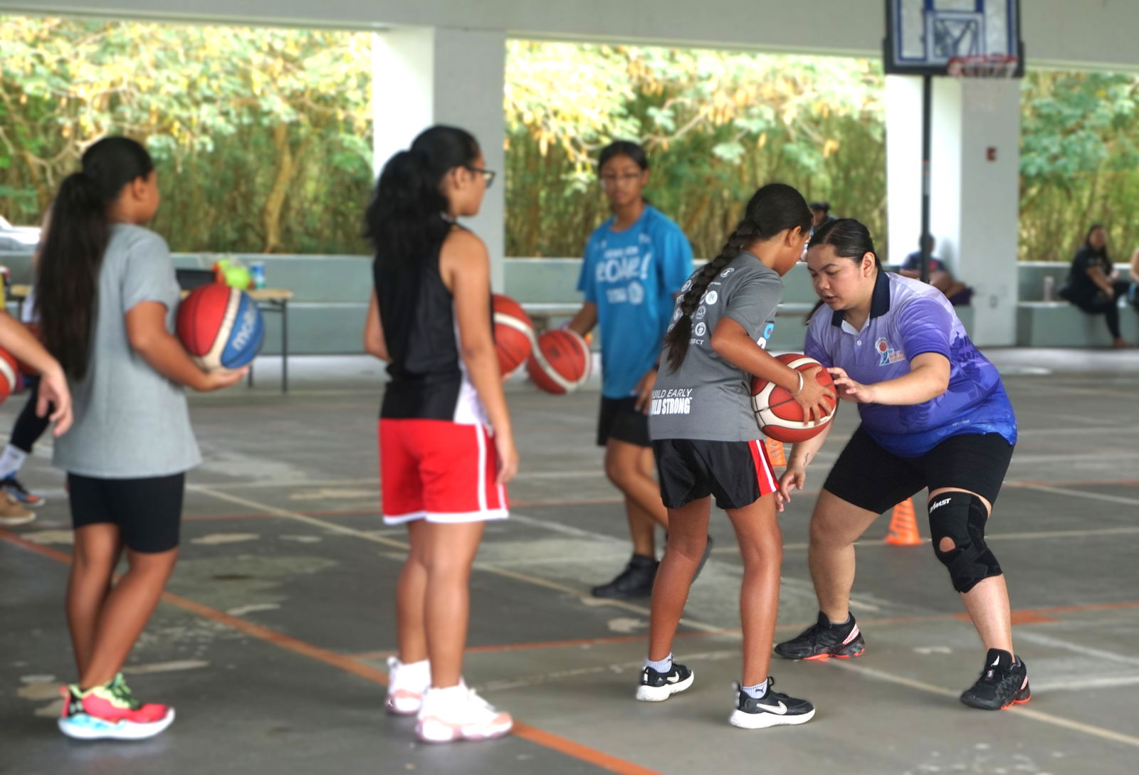 NMI Basketball Federation board member Marlene Lumabi leads a February camp at Koblerville gym.Photo by James F. Sablan Jr.