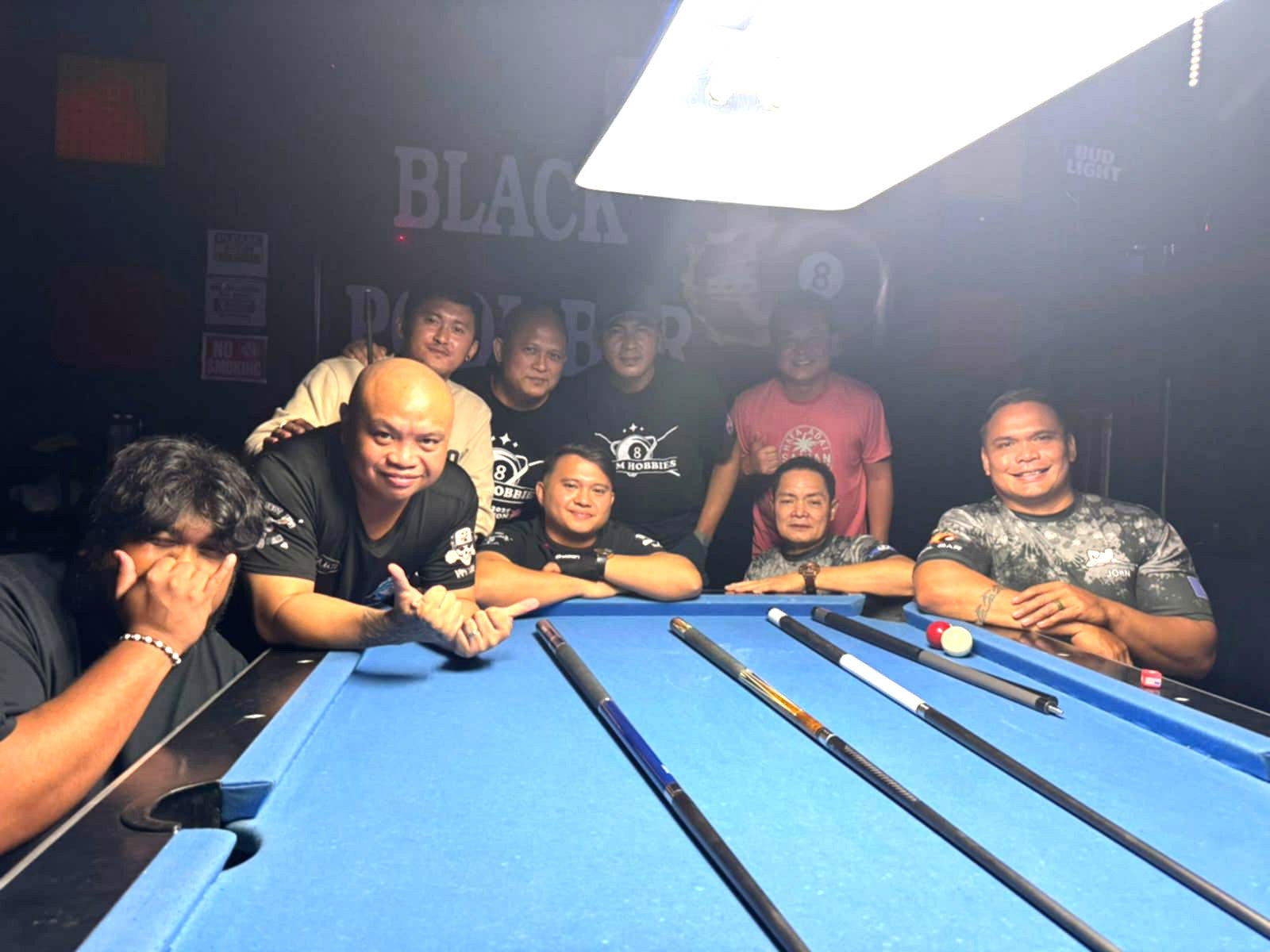 Last Shot Hobbies Sharks and Black 8 Crooked Arrow players pose for a group photo after their match in the Tuesday Division of the 2025 SBA Budweiser Open 8-Ball League at the Black 8 Pool Bar.Contributed photo 