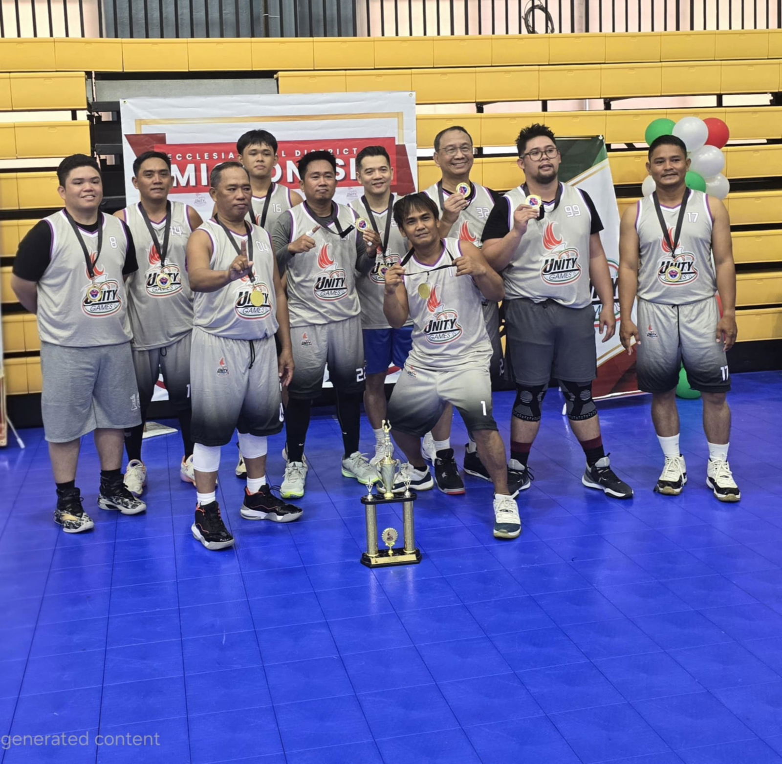 Team Gray members pose for a photo along with the championship trophy after defeating Team Green in the title game of the Church of Christ Unity Games 2025 at the Ada gym on Sunday.Contributed photo
