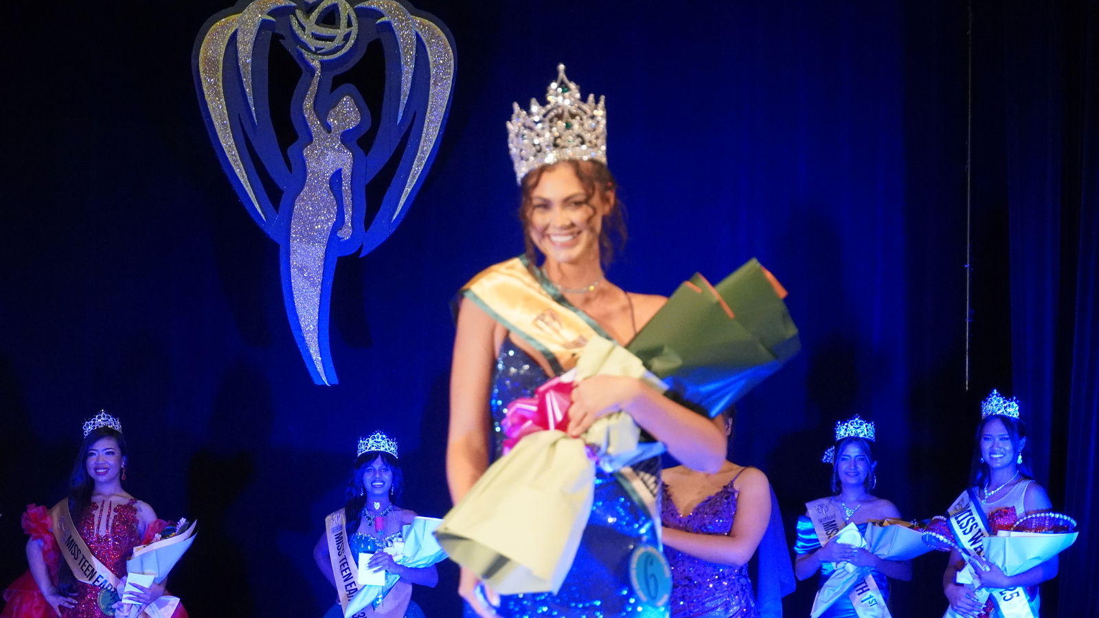 The new Miss Earth Northern Marianas, Aria Keilbach, takes center stage at the conclusion of the pageant.