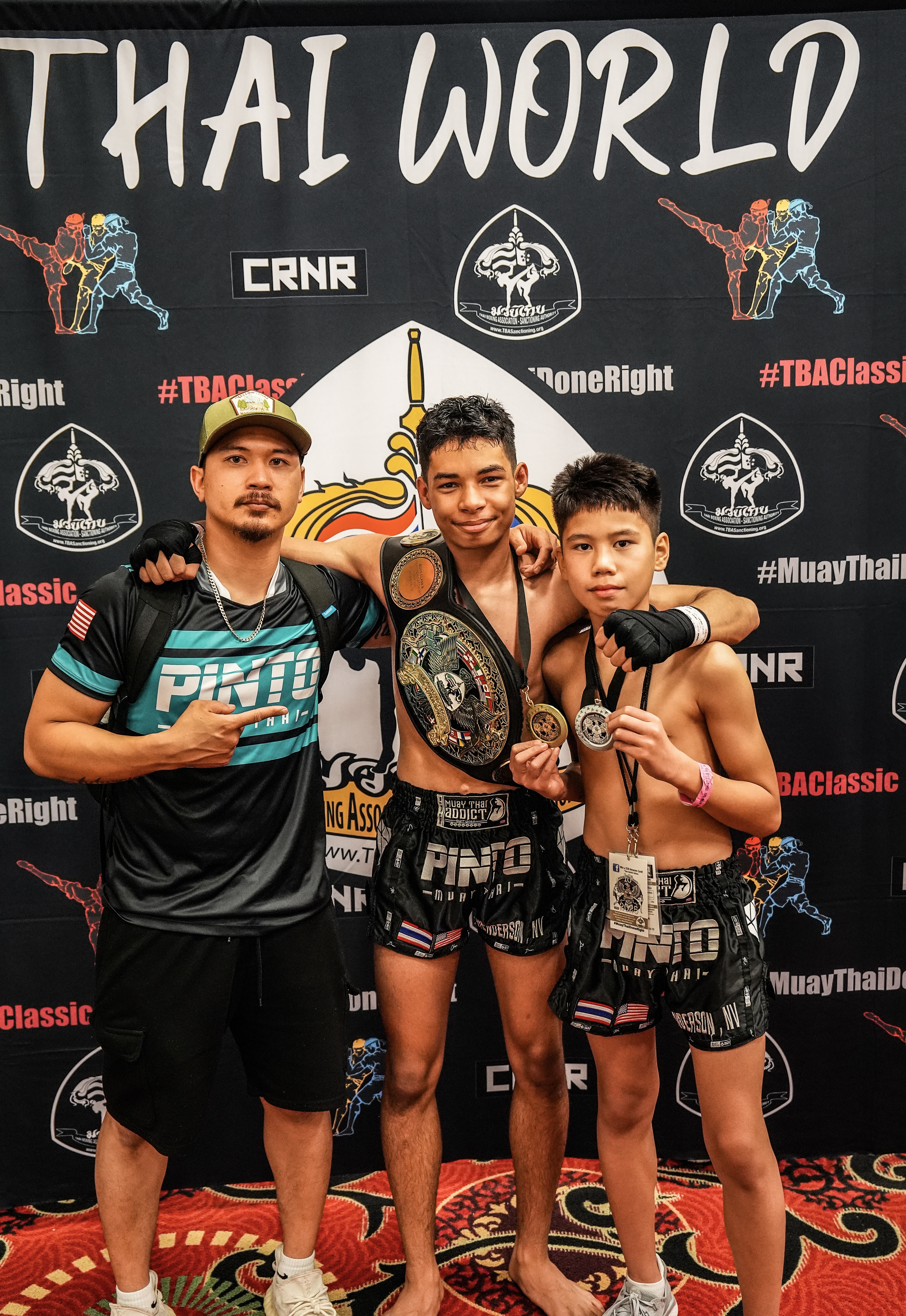 Jesse and Roman Concepcion pose for a photo with their gold and silver medals at the TBA Muay Thai Tournament in Des Moines, Iowa that was held on June 18 to 22.Contributed photo