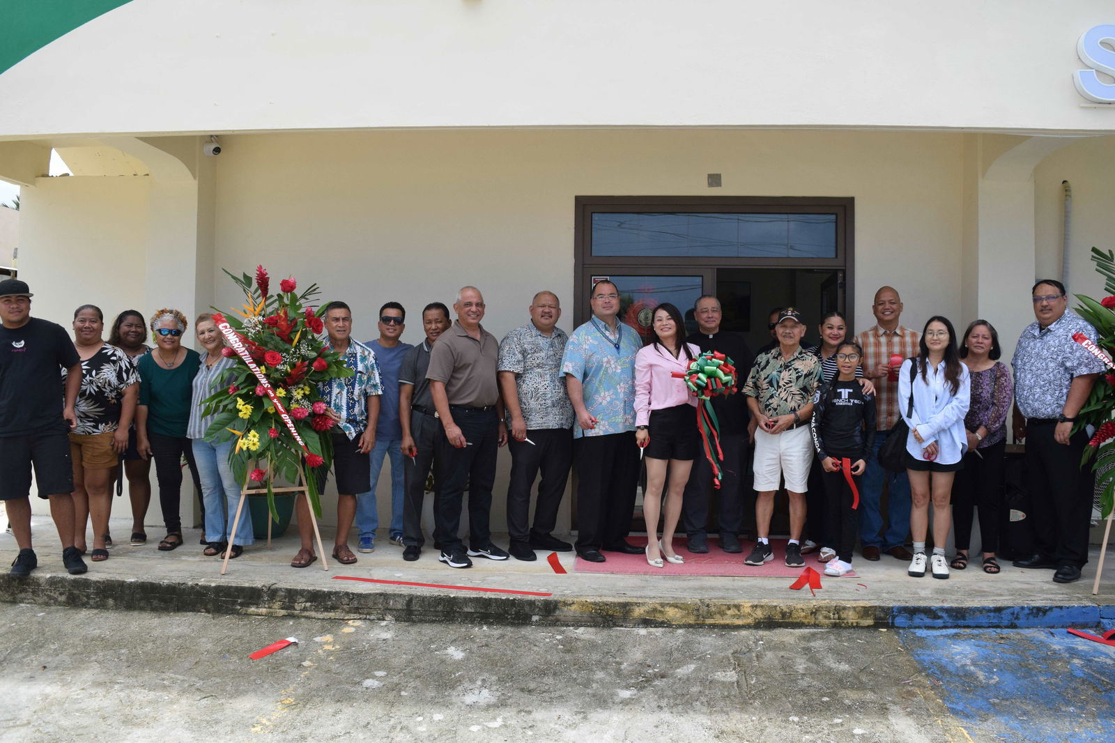 Saipan Green Energy Construction Company owner Stacy Wang, center, with Speaker Edmund Villagomez, Office of Grant Management and State Clearinghouse Administrator Epi Cabrera, right, other lawmakers and officials during a ribbon-cutting ceremony on Saturday.