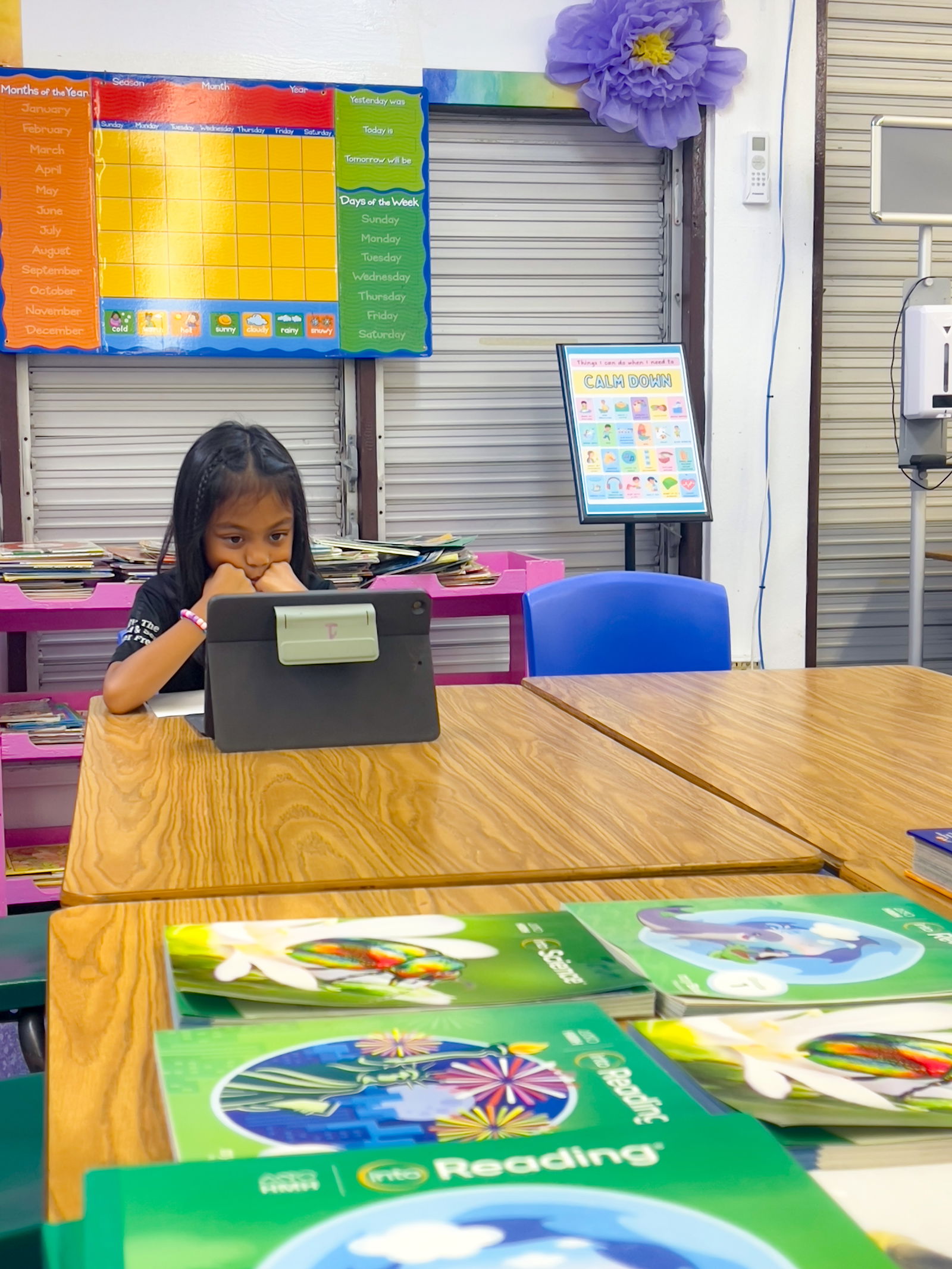 Student Rebecca Estrella reads technology-based learning instructions on her iPad.