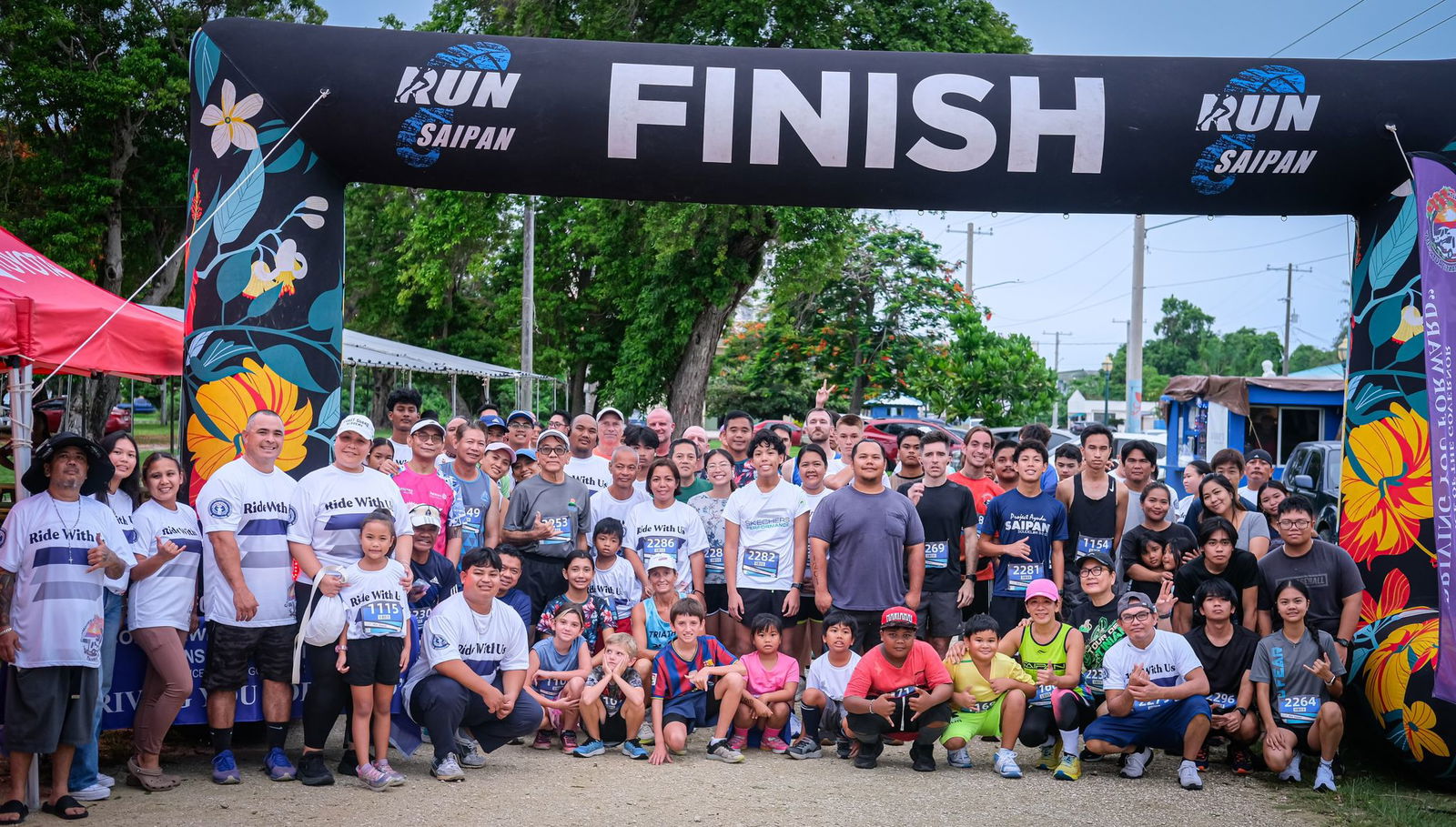 The participants of the inaugural Roll Out 5K, hosted by the Commonwealth Office of Transit Authority and Run Saipan, pose for a photo on Wednesday afternoon at  Garapan Fishing Base.Photo by Jonathan Sugatan