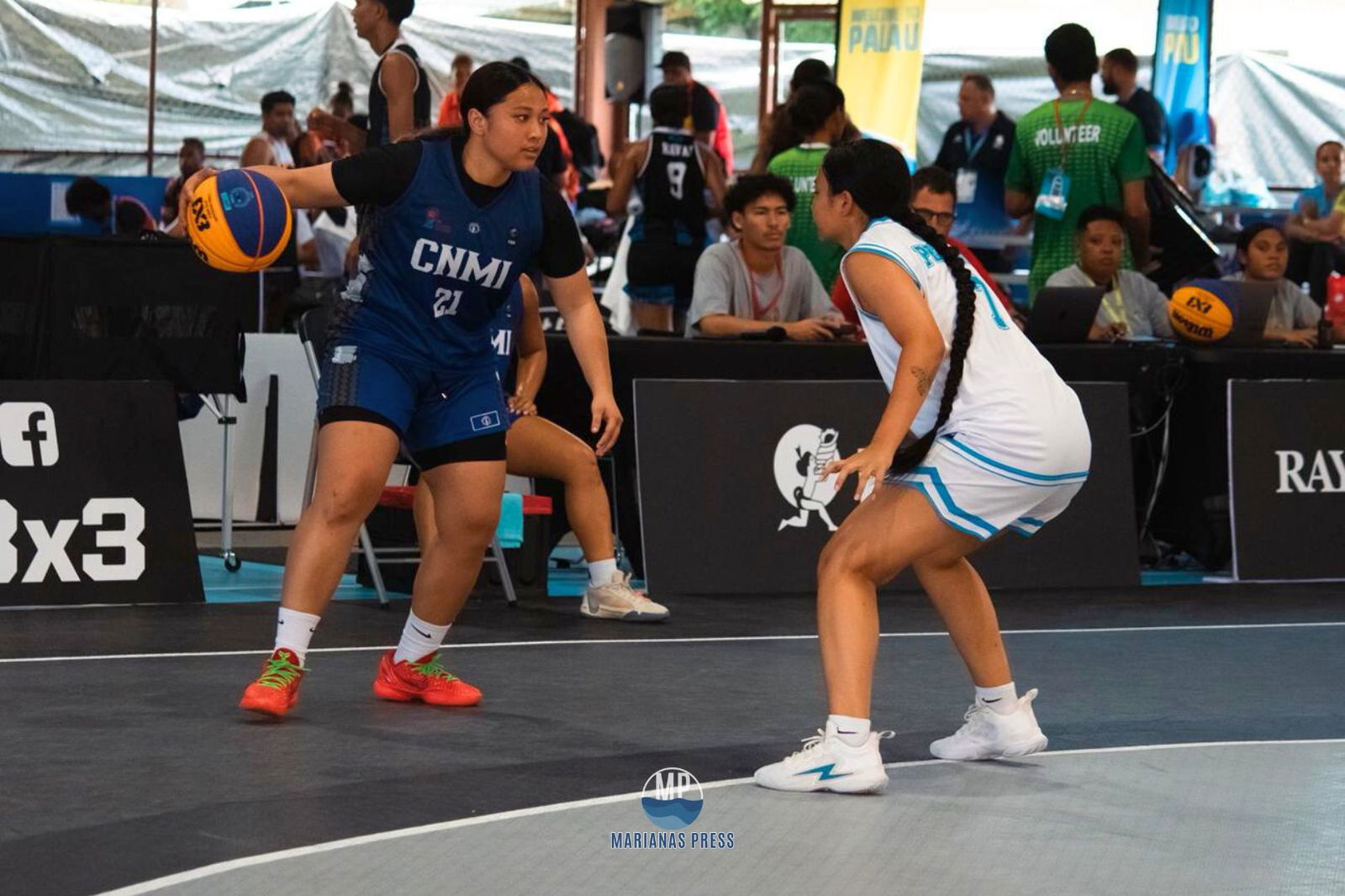 NMI’s Alliyah Fernandez, left, goes for an isolation play against an FSM defender during the last preliminary game in women’s 3x3 basketball.Marianas Press photo