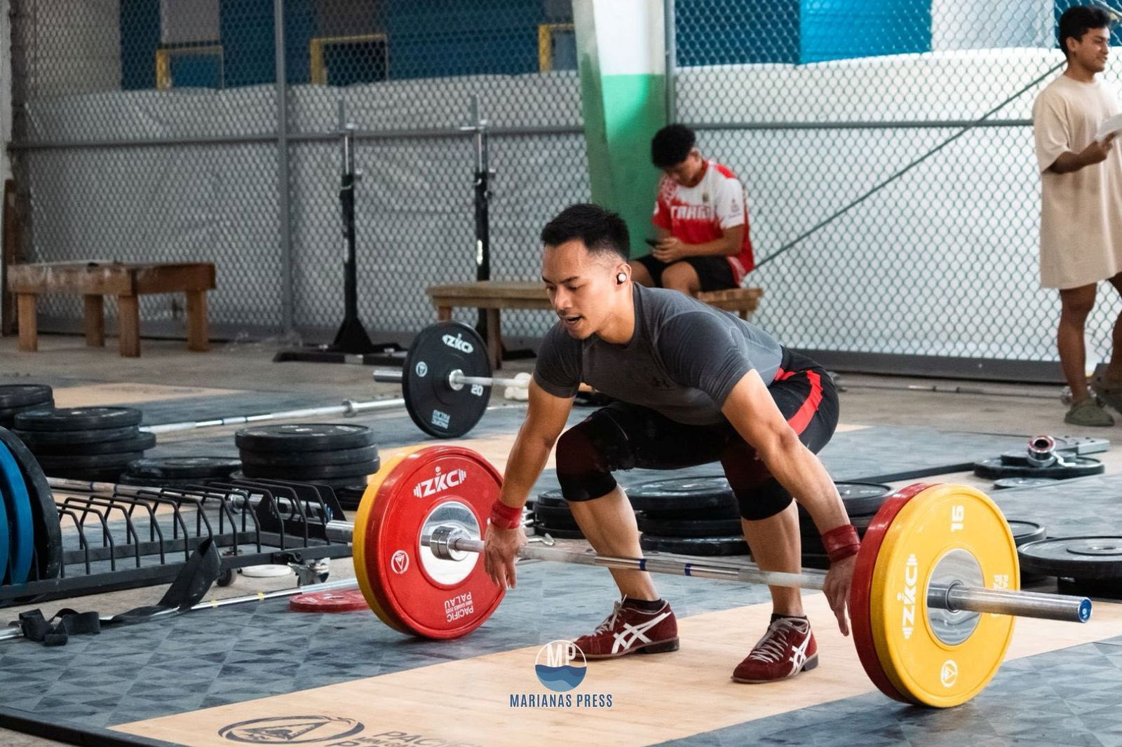 Leowell Cristobal won a pair of bronze medals in the 65kg class of the weightlifting competition on Wednesday.Marianas Press via NMSA
