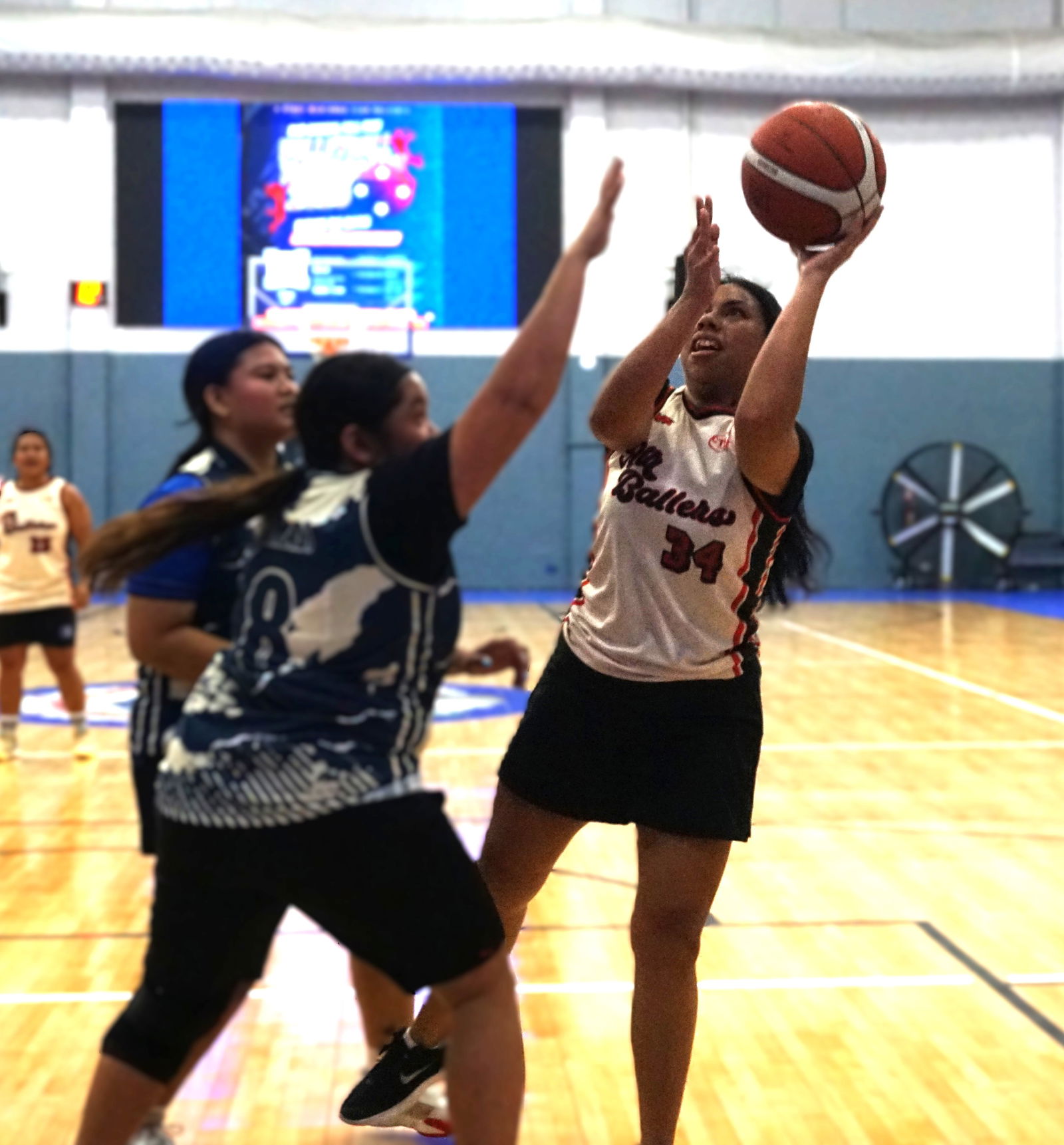 Air Ballers’ Wilani Sikyang takes the contested shot during a game in the women's division of the 2025 Allied Pacific Environmental Consulting Basketball League at the Ada gym.Photo by James F. Sablan Jr.