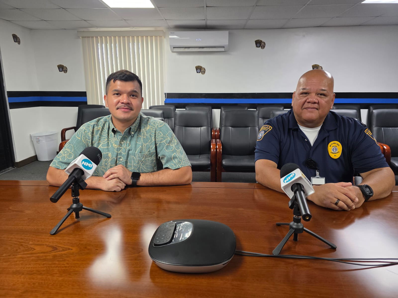 Adrian Pangelinan, the Department of Public Safety’s public information officer, with DPS Commissioner Anthony Macaranas at a press conference on Monday morning.Photo by Bryan Manabat