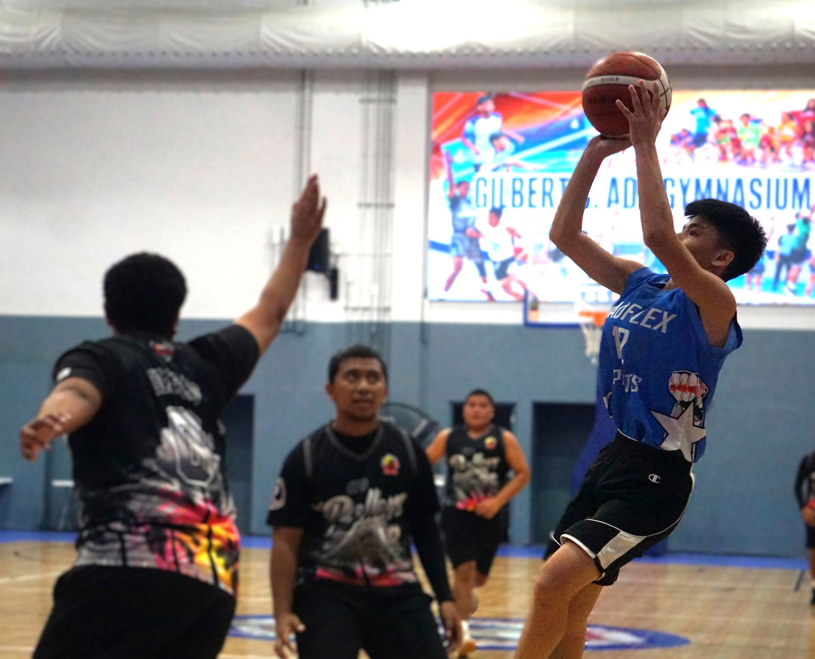 Xtreme Fitness’ Bernard Sabino takes the fadeaway jump shot during a game against Rollers 2  in the U18 Boys Division of the 2025 Allied Pacific Environmental Consulting Basketball League at the Ada gym on Monday night.Photo by James F. Sablan Jr.