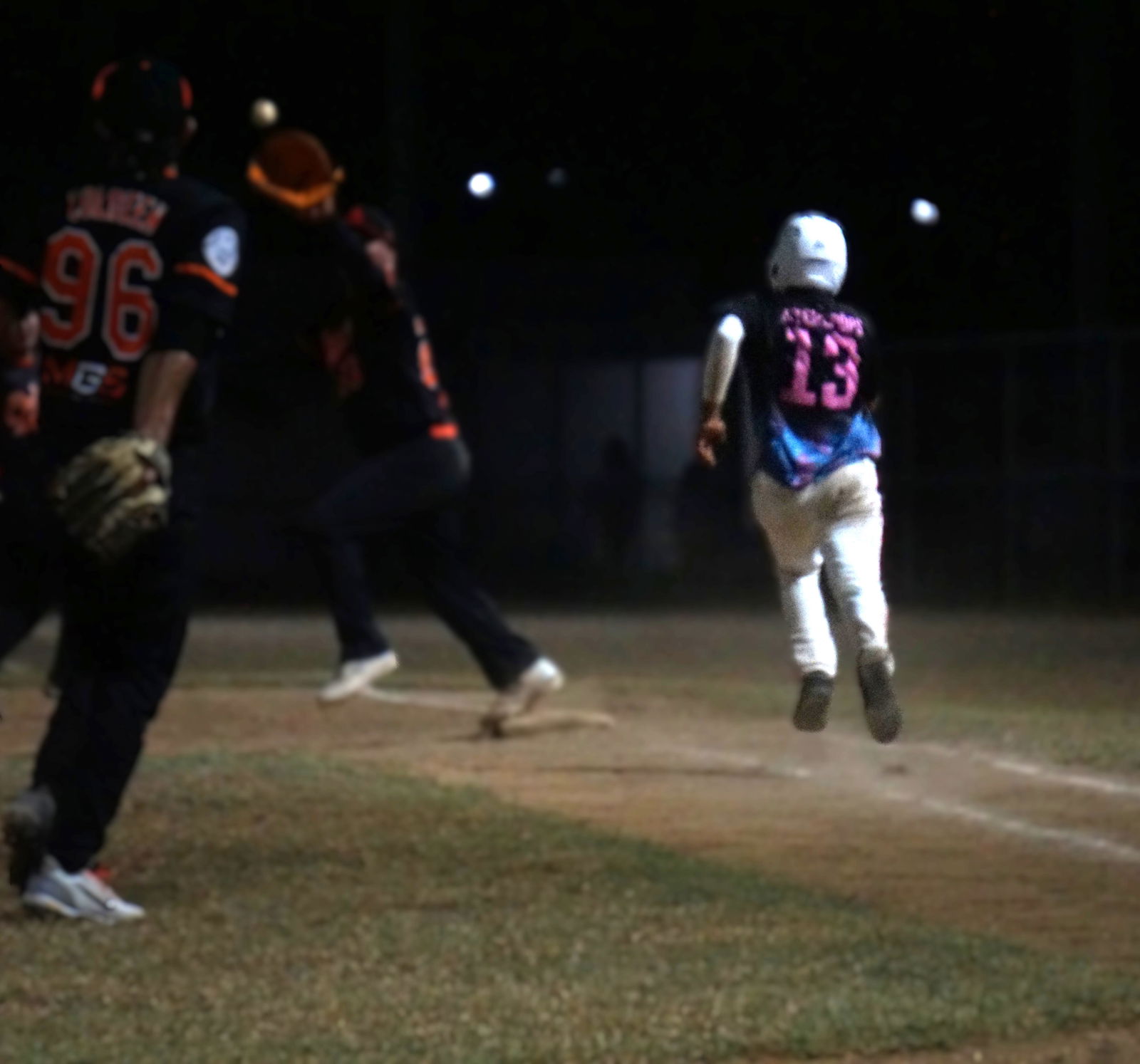 The Bears’ Ton Dizon races to first base to beat a pickoff attempt during a 2025 Saipan Baseball League game at Francisco “Tan Ko” Palacios Baseball Field.Photo by James F. Sablan Jr.