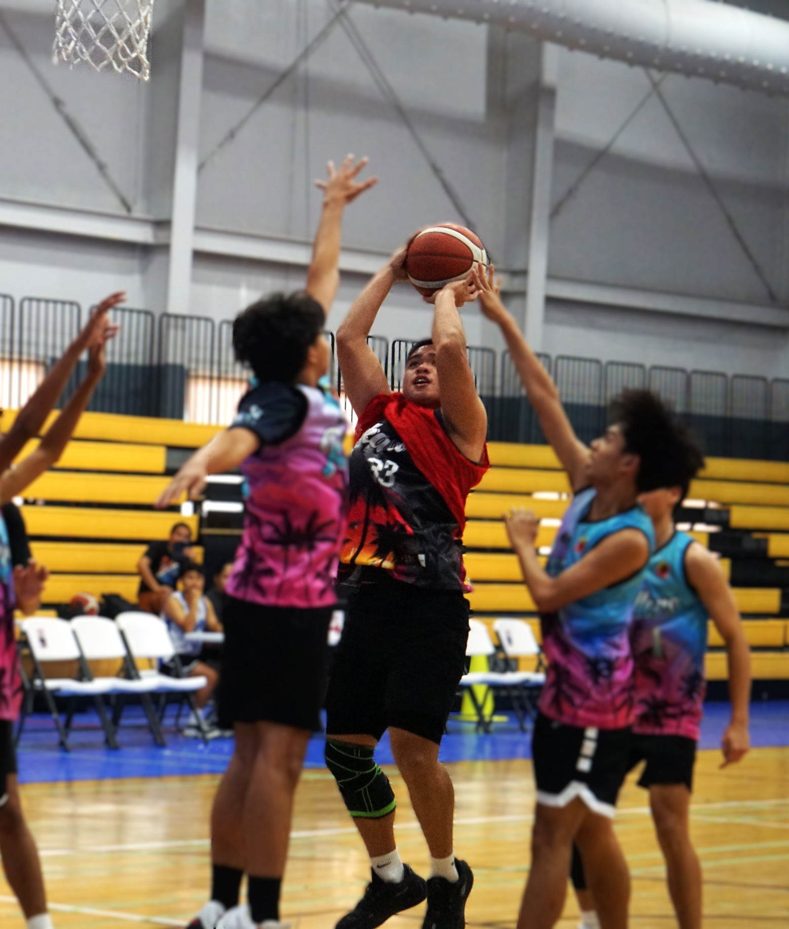 TurnKey Solution's Lance Lerio takes the heavily contested jumper during a game in the U18 Boys Division of the 2025 Allied Pacific Environmental Consulting Basketball League at the Ada gym.Photo by James F. Sablan Jr.
