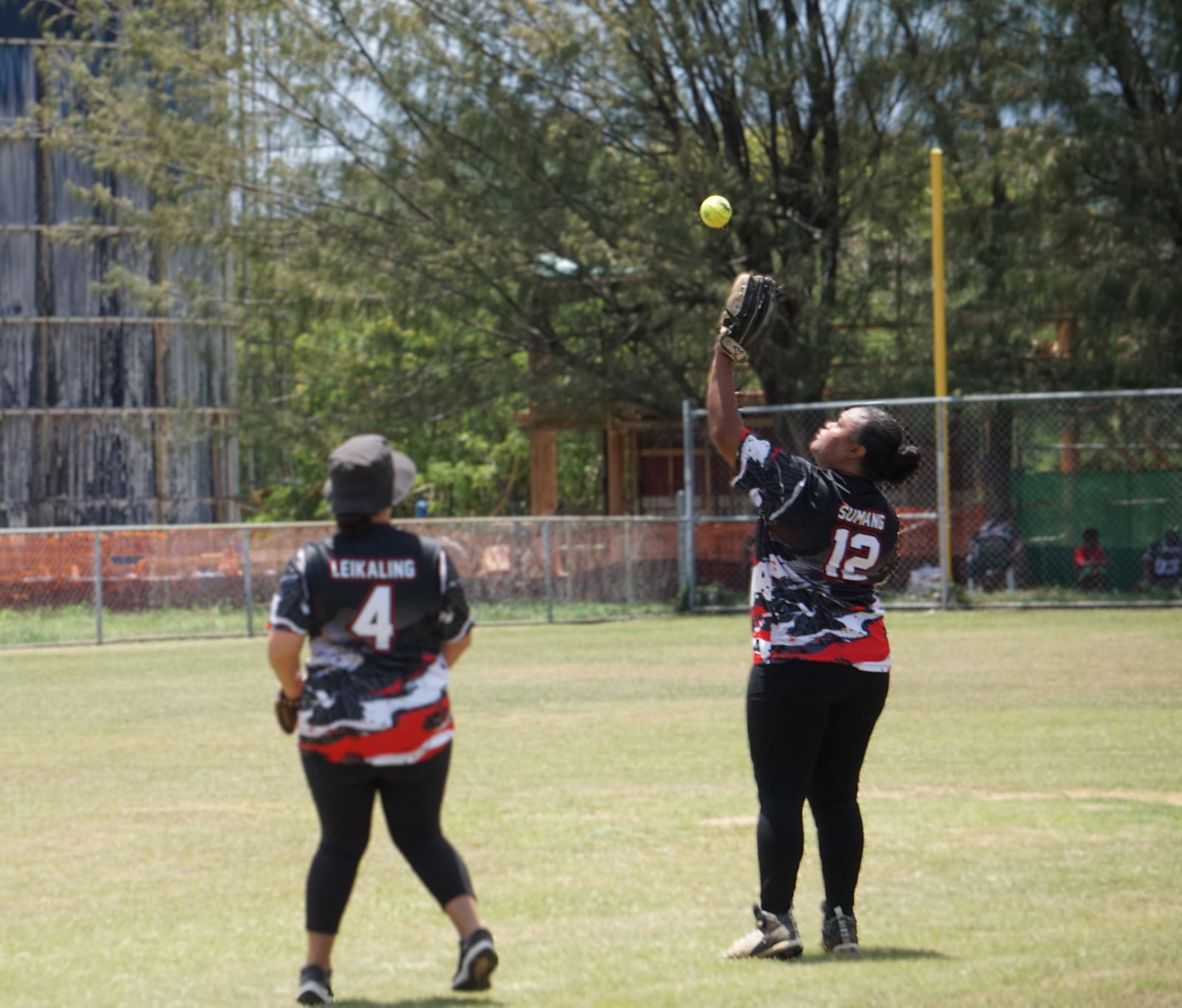 Bat & Boujee third baseman Allana Sumang catches a flyout during a game in the women's division of the 2025 Budweiser Belau Amateur Softball Association League at the Dandan baseball field.Photo by James F. Sablan Jr.