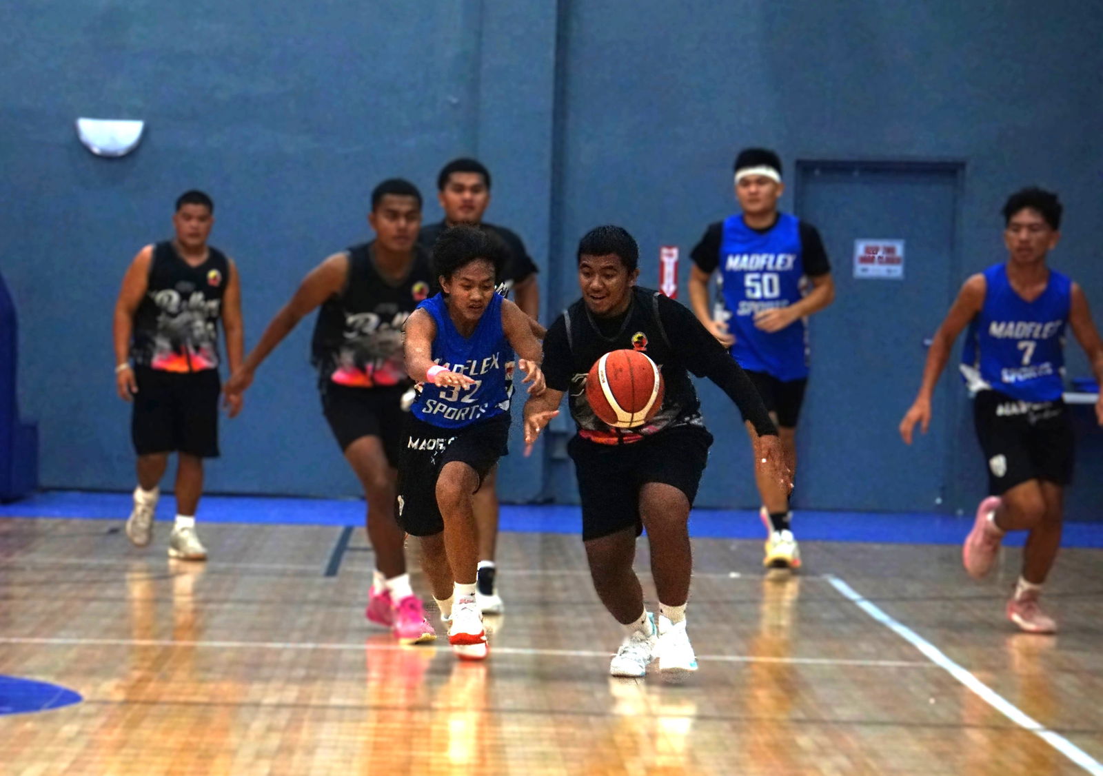 Xtreme Fitness’ Cyrus Galope and Rollers 2’s Kachuo Norech race after the loose ball during a U18 Boys Division game of the 2025 Allied Pacific Environmental Consulting Basketball League at the Ada gym on Monday night.Photo by James F. Sablan Jr.