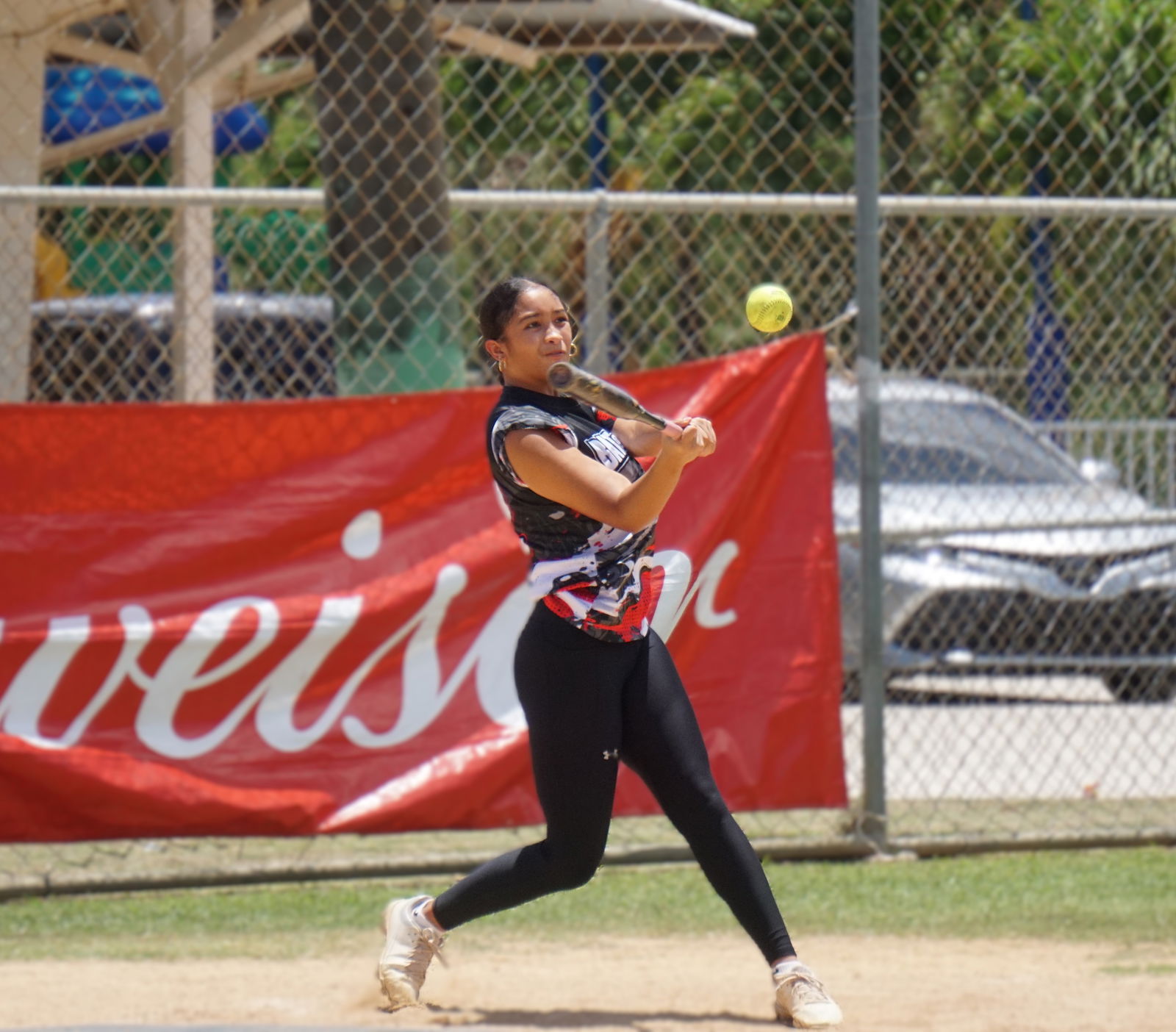Bat & Boujee's Jayda Norita hits a single during a game in the women's division of the 2025 Budweiser Belau Amateur Softball Association League at the Dandan baseball field.Photo by James F. Sablan Jr.