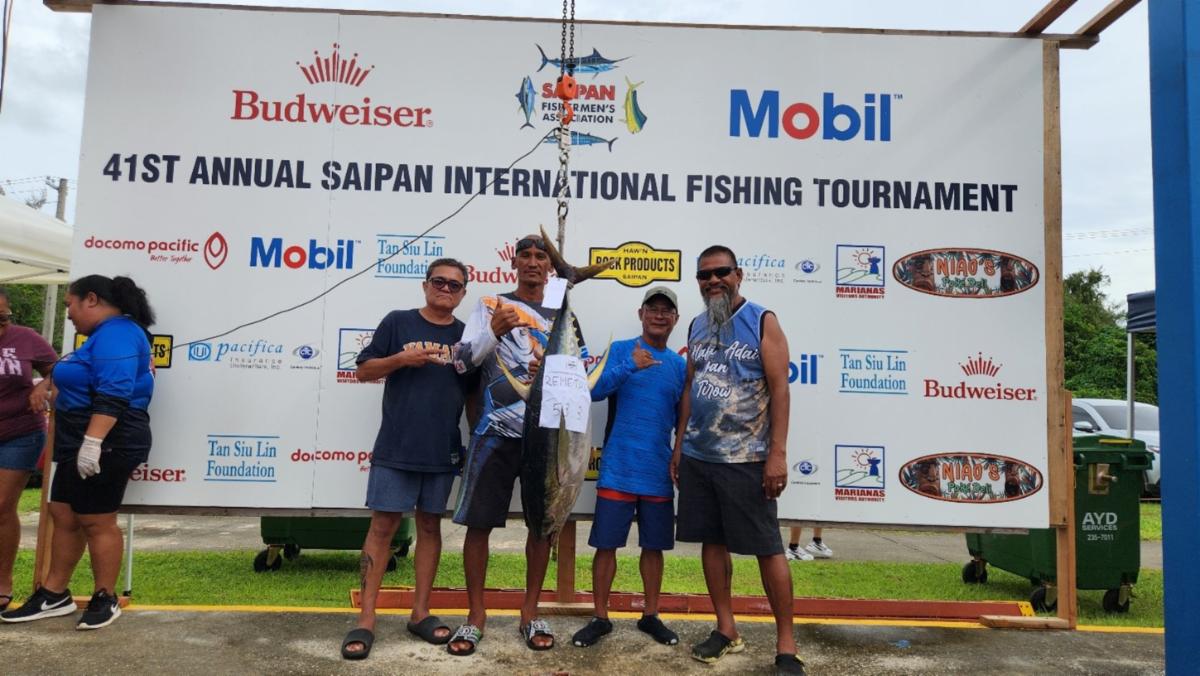 Captain Cecilio Raikuilipiy and crew display a 53.3-lb. yellow fin tuna at the Saipan International Fishing Tournament on July 13, 2025, at Smiling Cove Marina. The tournament attracted 75 boats from the Northern Marianas and Guam.