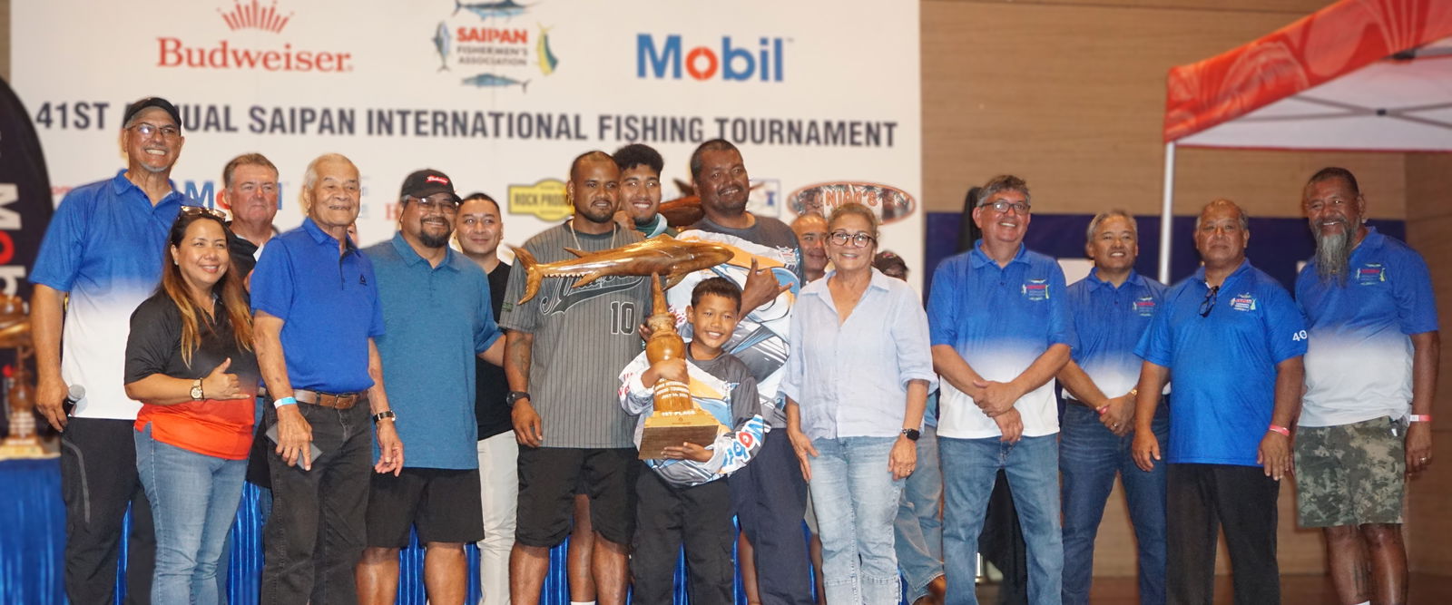 Rose 1 crewmembers pose alongside SFA board members as the first-place winner in the Wahoo category during the awards banquet for Saipan Fishermen's Association's 41st Saipan International Fishing Tournament at the Taga Hall of Saipan World Resort on Monday night.