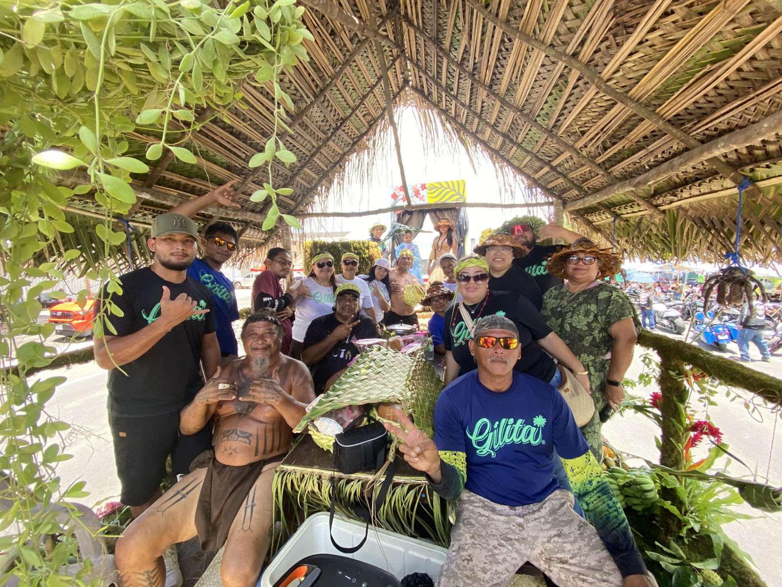 Rota residents and their mayor, Aubry Hocog, pose for a group photo aboard their float.