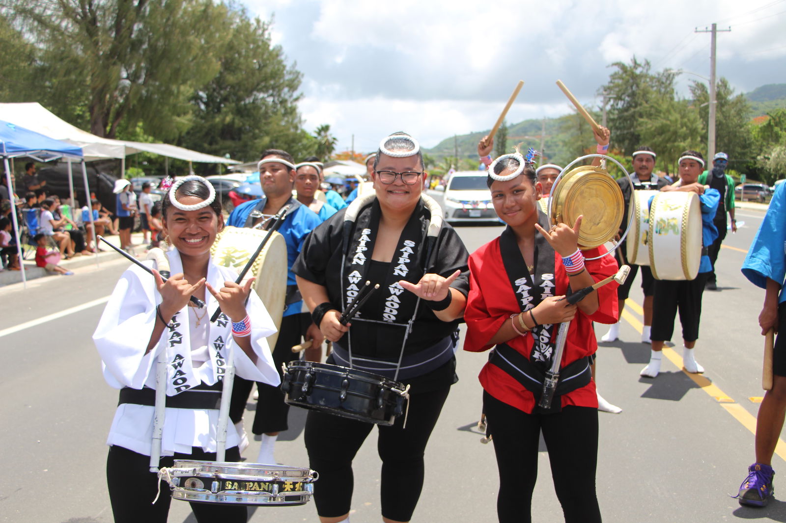Three of Saipan Awaodori team members pose for a photo as they join the Liberation Day Parade on Beach Road on July 4, 2025.