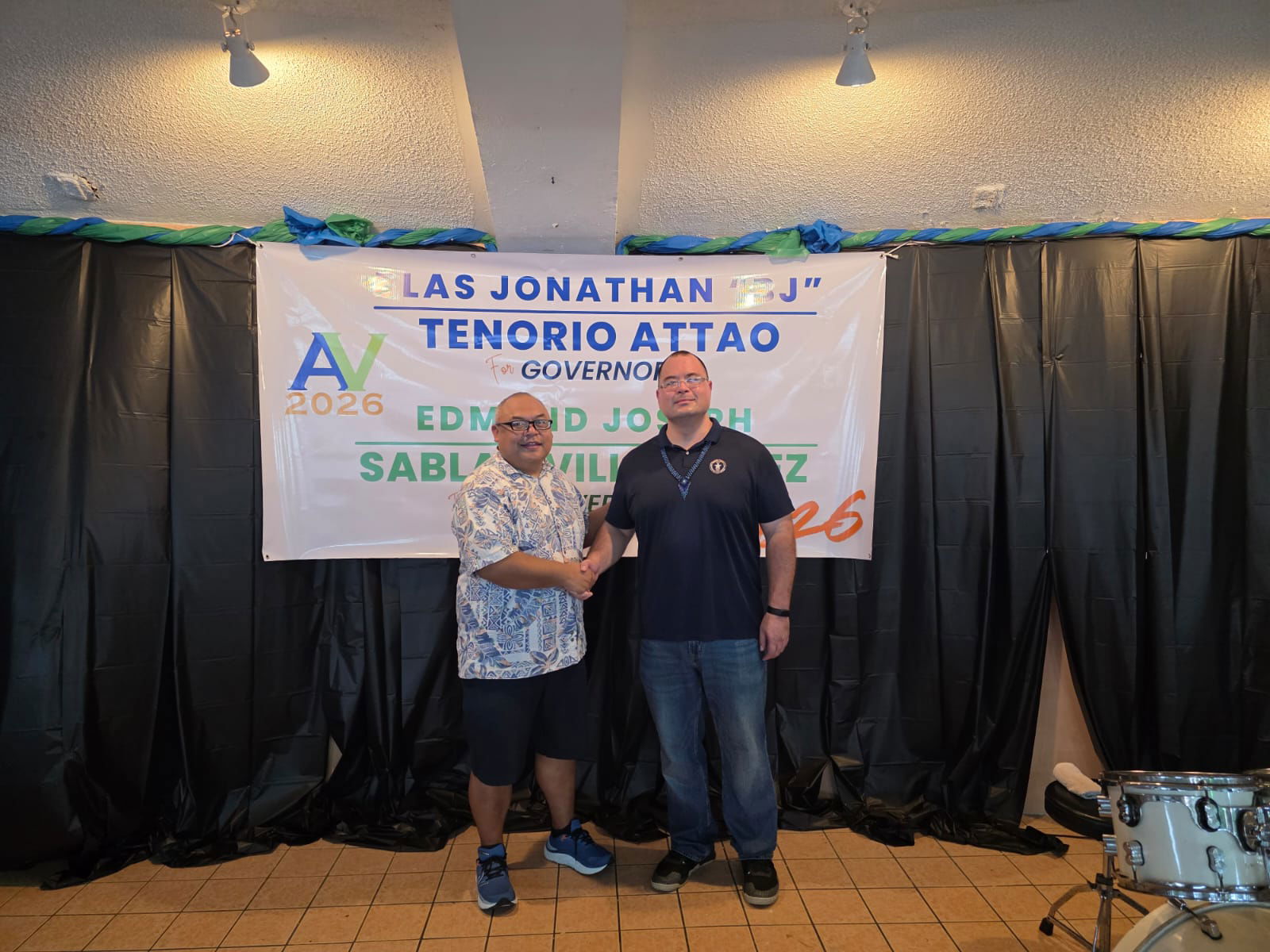 Rep. Blas Jonathan Tenorio Attao and Speaker Edmund Sablan Villagomez shake hands during a gathering at Garapan Central Park on Saturday.