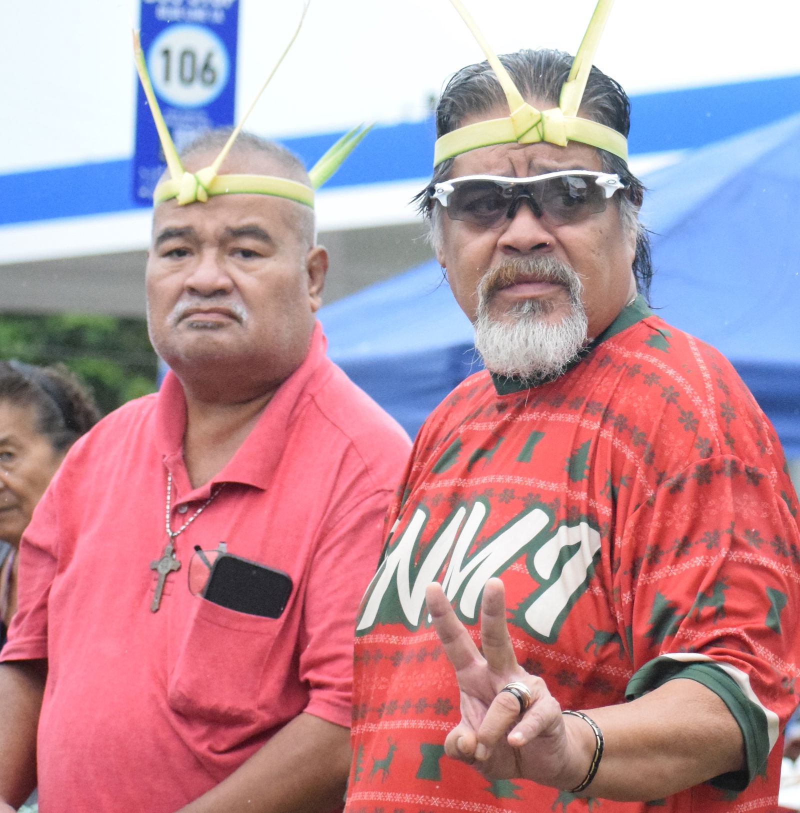 Uraali Refaluwasch Association senior advisor Melvin L.O. Faisao and Chamolinian Cultural Village Inc. chairman Gordon Marciano were among the residents who stood along the roadside to pay tribute to the late Gov. Arnold I. Palacios on Saturday.Photo by Emmanuel T. Erediano