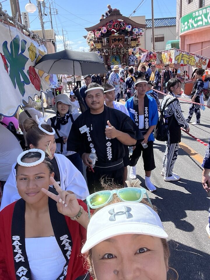 A resident of Katori City takes a selfie with Saipan Awaodori Team members during the  Omigawa Gion Matsuri Festival.