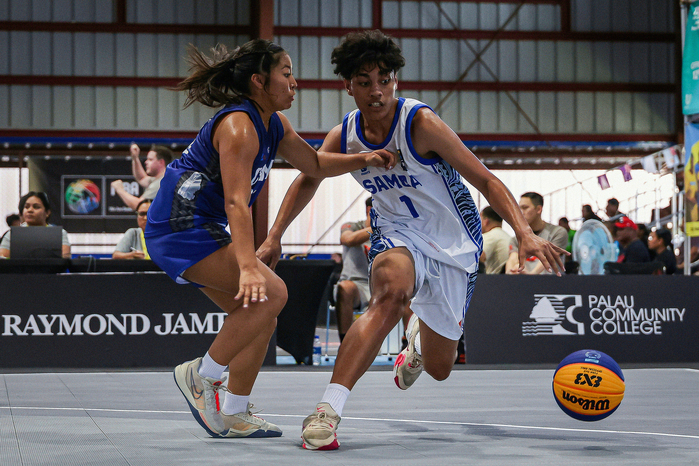 NMI’s Yasmeen Younis, left, plays tough defense on a Samoa player during their game in the 3x3 basketball Wednesday night at Palau High School Gymnasium.ANOC via NMSA