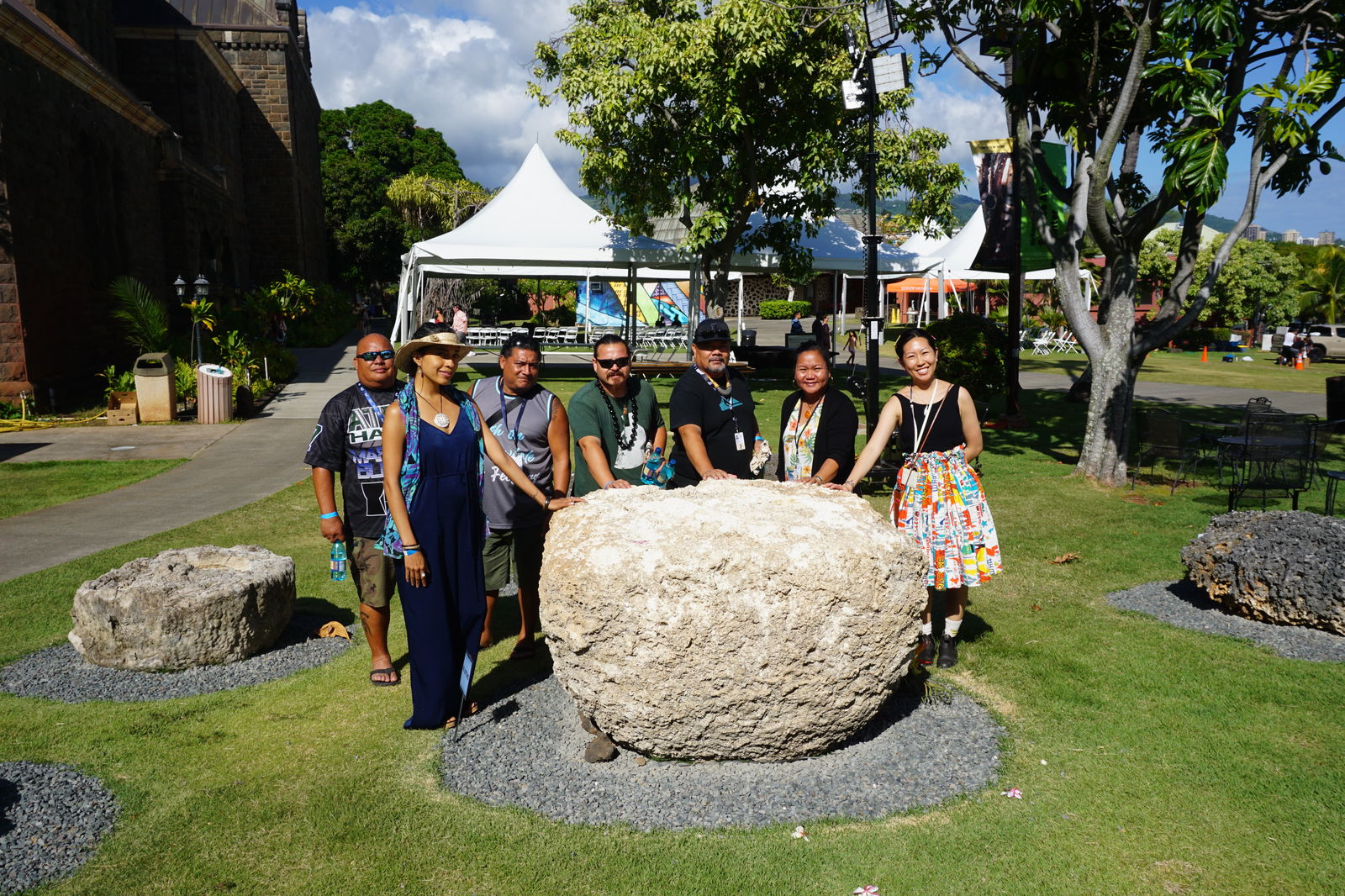 This latte, which is separate from the Hornbostel Collection, came from Rota. The Marianas residents who were in Hawaii for FestPac 2024 gathered around it for a photo. From left, Jack Diaz, Eva Cruz, Jason Aldan, Tyler Warwick, Martin Naputi, Erlinda Naputi, and Bishop Museum's Sarah Kuaiwa.