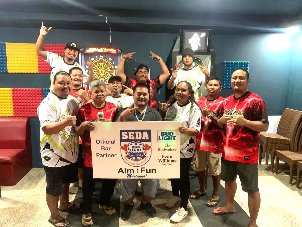 Black 8 Darty Gentz and Tom Yum Darting Dinanchi players pose for a group photo after their match in the Kingfisher C Division of the 2025 SEDA Bud Light Dart League at the Black 8 Pool Bar on Wednesday night.Contributed photo