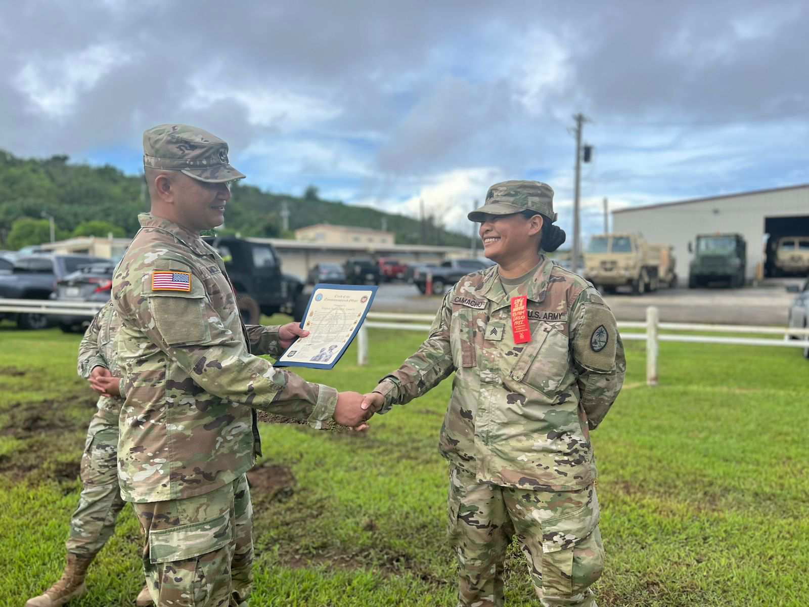 Sgt. Stephanie Camacho receives an award from her commander.Contributed photo
