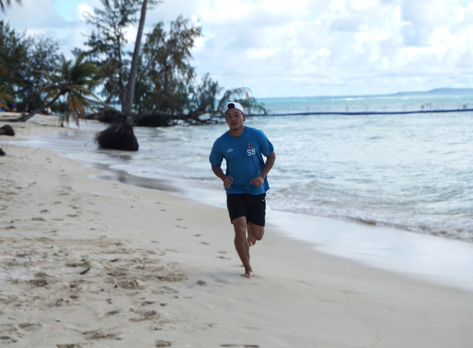 Marpac's Coby Santos completes the final leg in the corporate division of the Run Saipan’s 4th Annual Michelob Ultra Beer Mile at Marianas Beach Resort Saipan during the Budweiser Burger Fest on Saturday.Photo by James F. Sablan Jr.