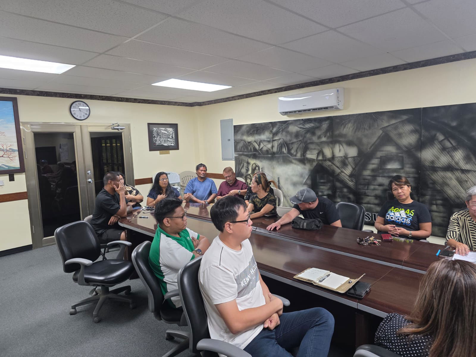 Ben Ki operator Marianne Teregeyo gestures as she speaks at the meeting with Liberation Day Committee members on Aug. 19, 2025.