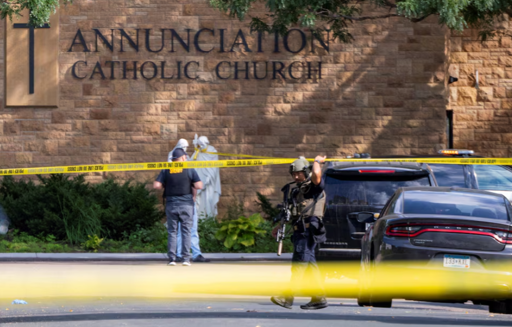 Law enforcement officers set up barriers after a shooting at Annunciation Church, which is also home to an elementary school, in Minneapolis, Minnesota, Aug. 27, 2025.REUTERS