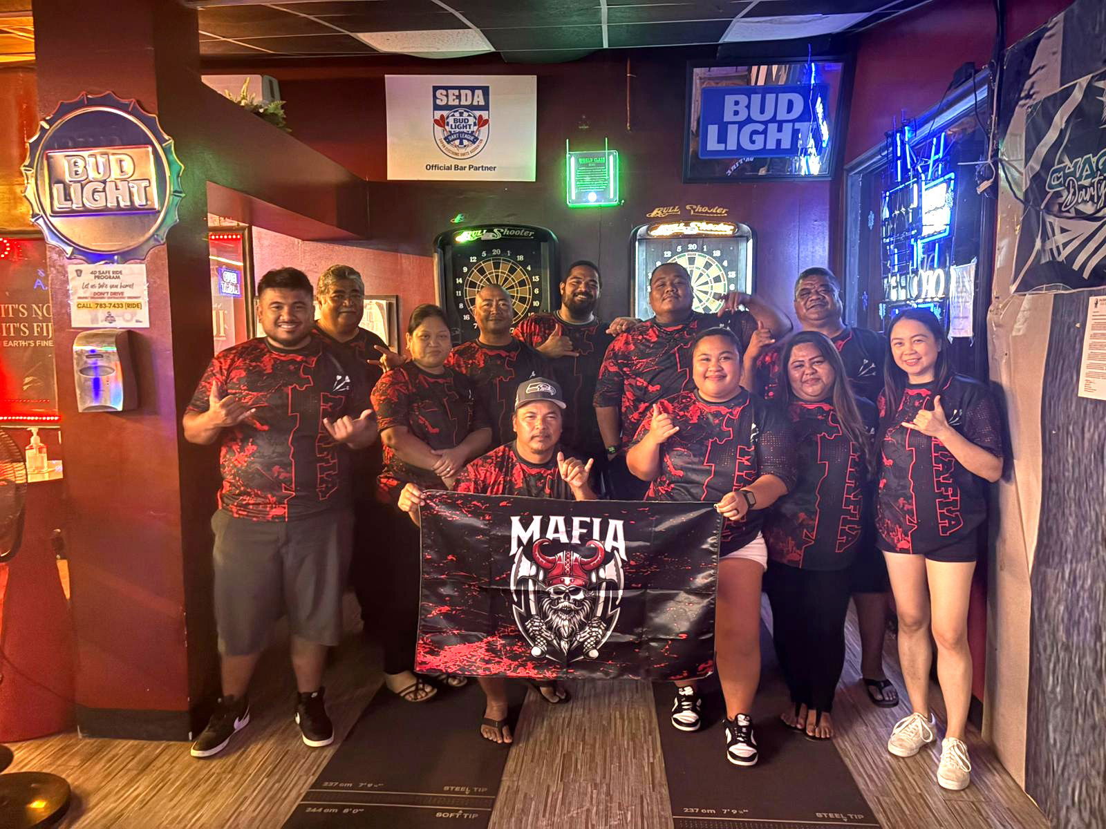 The 9Eleven Mafia players pose for a group photo after their win in the inter-government division of the 2025 SEDA Bud Light Dart League at the 9Eleven Restobar on Friday.Contributed photo
