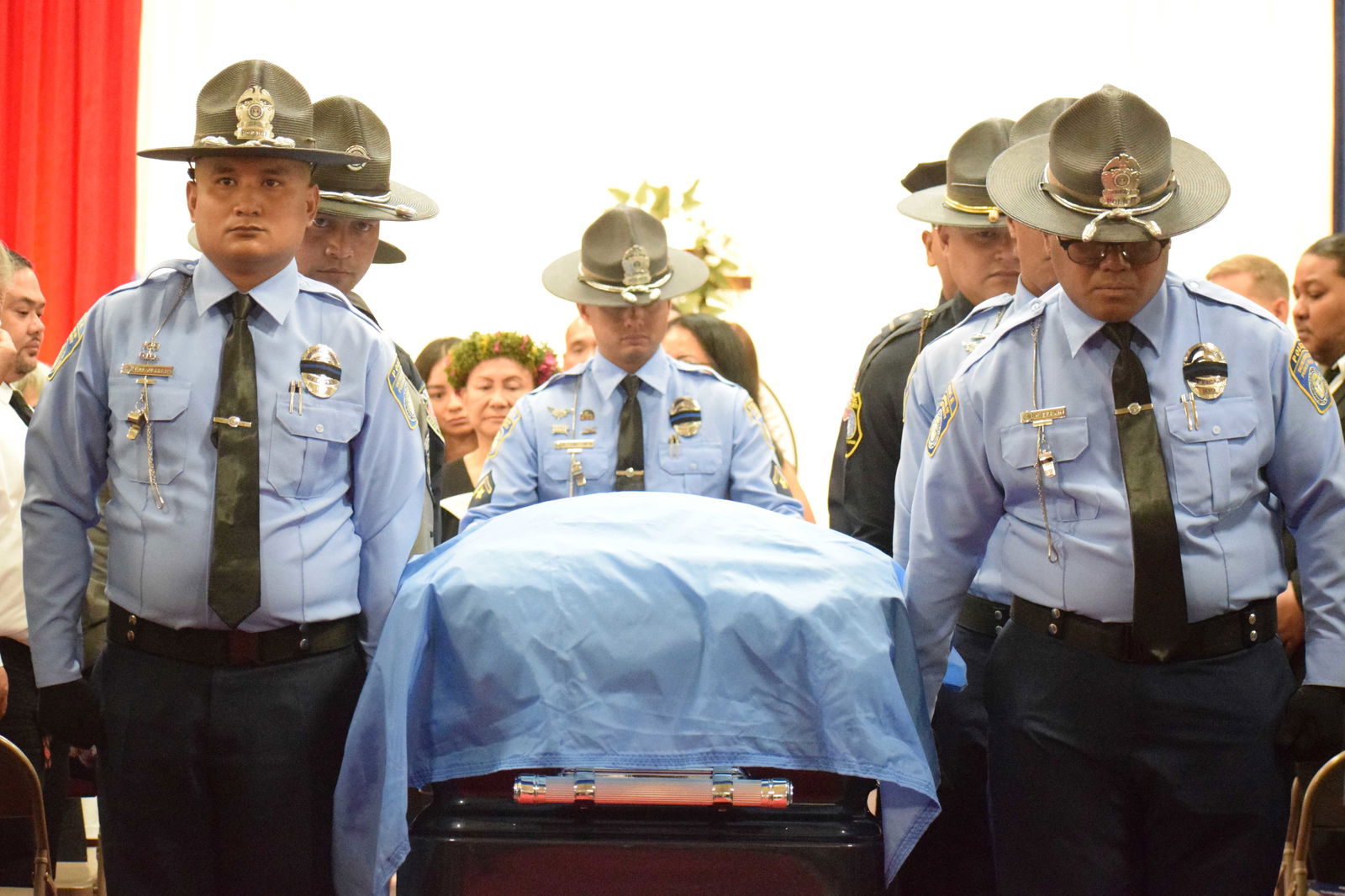 Officers of the Department of Public Safety carry Gov. Arnold I. Palacios' casket out of the multi-purpose center in Susupe at the conclusion of the state funeral on Saturday.Photos by Emmanuel T. Erediano