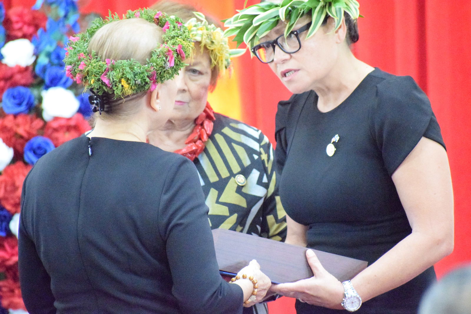 U.S. Congresswoman Kimberlyn King-Hinds of the CNMI and U.S. Congresswoman Aumua Amata of American Samoa express sympathy to First Lady Wella Palacios.