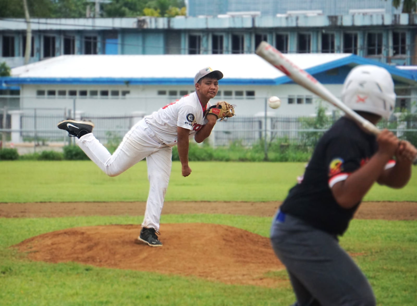 The Braves Jr.'s Kayden Lizama pitches against the Ol'Aces Jr. during the junior division championship game of the 2025 Saipan Little League Baseball at the Francisco "Tan Ko" Palacios Baseball Field on Saturday.